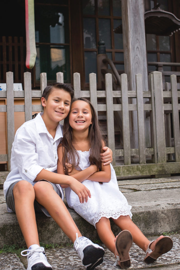 brother hugging sister downtown yokosuka