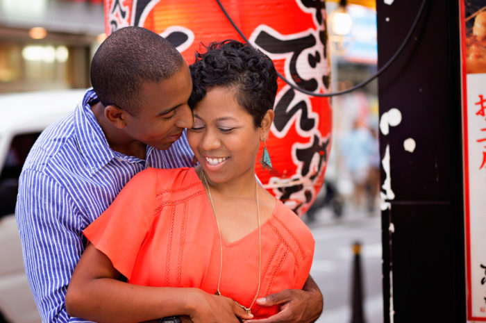 couple holding each other in downtown yokosuka japan