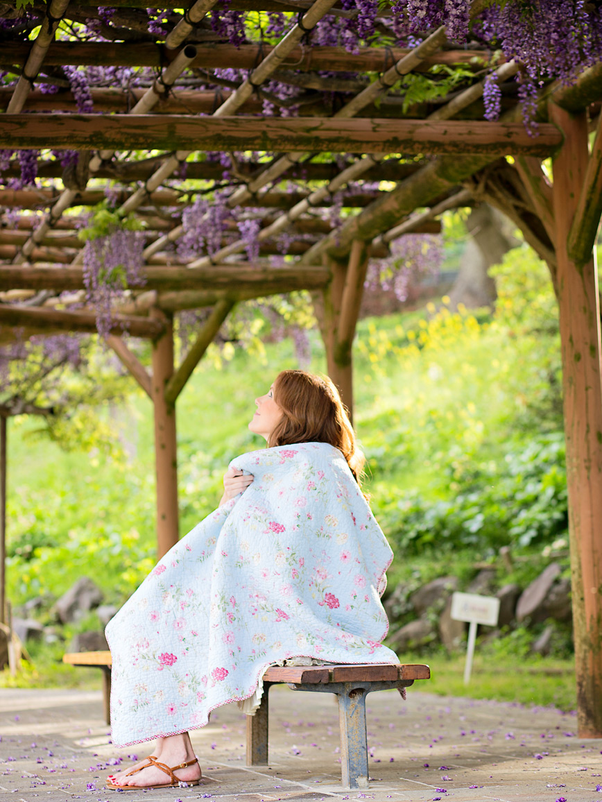 woman sitting in park with baby